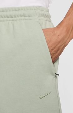 Whether hanging out of hitting the gym, comfort is key in these versatile shorts made with handy pockets for essentials and the brand's Dri-FIT moisture-wicking technology. 7" inseam; 24" leg opening; 10" front rise; 12 1/2" back rise (size Medium) Elastic/drawstring waist Hidden side-zip pockets; back drop-in pocket Dri-FIT moisture-wicking technology 78% polyester, 22% cotton Machine wash, dry flat Imported Nike Cotton Activewear With Built-in Shorts, Nike Athleisure Athletic Shorts With Elastic Waistband, Green Sporty Athletic Shorts With Side Pockets, Sporty Green Athletic Shorts With Side Pockets, Functional Short Bottoms With Comfort Waistband, Relaxed Fit Sportswear Shorts With Side Pockets, Nike Gym Shorts With Elastic Waistband, Green Athletic Shorts With Pockets, Sports Shorts With Hip Pockets