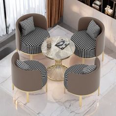 four chairs and a table in a room