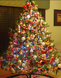 a brightly lit christmas tree in a living room