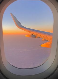 an airplane wing is seen through the window