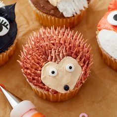 cupcakes decorated to look like hedgehogs with googly eyes