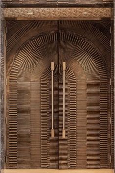 an art deco style door with metal handles