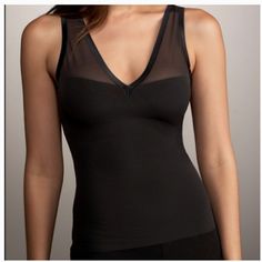 Spanx Haute Spanx 476 Alluring V-Neck Camisole Black From Spanx Haute Contour Line It’s Obvious Spanx Is Designed By Women For Women With This Spanx Alluring V-Neck Camisole. For Any V-Neck Dress, This Is The Perfect Tool To Slim And Support. The Reinforced Front Microfiber Panel Shapes And Supports The Stomach And Waist Area. Size - Xs Color - Black Style - 478 Condition - Brand New With Tag Nwt Inc-Shaper-Panties-1 Bra-friendly Fitted V-neck Tank Top, Seamless Stretch V-neck Camisole, Fitted Low-cut Tank Top With Built-in Bra, Fitted V-neck Top With Medium Bust Support, V-neck Shapewear With Built-in Bra, Black Camisole With Built-in Bra For Layering, Summer V-neck Shapewear With Built-in Bra, Seamless Fitted V-neck Shapewear, Stretch V-neck Bra Friendly Camisole