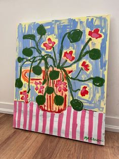 a painting with flowers in a vase on a table