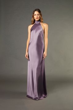 a woman in a long purple dress