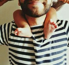 a man is holding his baby in his arms with a quote on the chest that says, a good father is one of the most uninsing, unparanished,