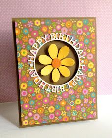 a birthday card with a flower cutout in the center and words happy birthday on it