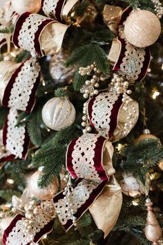 a christmas tree decorated with ornaments and ribbons