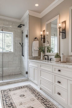 a large bathroom with two sinks and a walk in shower