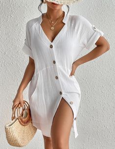 This Lightweight Pocketed Short Sleeve Beach Dress is a versatile and stylish option for any beach day. Made from lightweight fabric, it offers a comfortable and breathable fit. With convenient pockets, you can easily carry your essentials without sacrificing style. Stay cool and chic with this must-have beach dress. This women's bikini cover up is made of cotton fabric with excellent skin-friendliness and softness, lightweight and breathable Brown buttons add style to the solid-colored swimsuit Casual Beach Season Dress With Pockets, Casual Beach Dress With Pockets, Casual V-neck Beach Dress For Day Out, Beach V-neck Dress With Pockets, Casual White Beach Dress For Vacation, Solid Summer Beach Dress Cover-up, Solid Color Casual Beach Dress For Spring, Casual Solid Beach Dress For Spring, Relaxed Summer Beach Dress