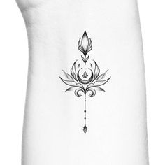 a black and white drawing of a lotus flower on a white tank top with an arrow in the center