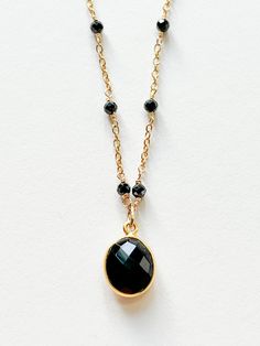 One of a kind necklace designed by artisan Sage Machado in Los Angeles, California Material: Sterling Silver with 24K Gold Plate Measurements: - Adjustable Chain Length: 16-19 in - Pendant Size: 1" H x 1/2" W Onyx is a powerful protection stone, it absorbs and transforms negative energy, and helps prevent the drain of personal energy. Black Onyx fosters wise decision-making, and encourages happiness and good fortune. Black Jewelry With Oval Link Cable Chain, Black Oval Link Cable Chain Jewelry, Black Oval Link Jewelry For Gifts, Black Jewelry With Oval Beads As A Gift, Black Oval Beads Jewelry For Gift, Black Oval Beaded Jewelry As Gift, Black Oval Beaded Jewelry Gift, Handmade Black Necklace With Oval Beads, Handmade Black Necklaces With Oval Beads