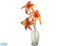 there is a white vase with orange flowers in it