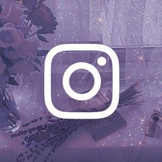 the instagram logo is surrounded by flowers and candles