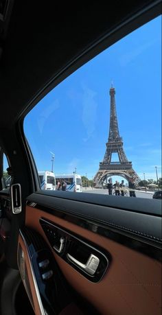 the eiffel tower seen from inside a car