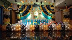 an entrance decorated with balloons and streamers