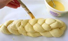 a person is making bread on a table