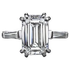 an emerald cut diamond ring with baguetts