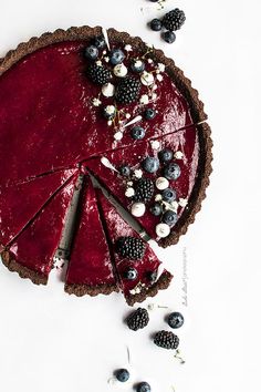 a pie with berries and blueberries on it