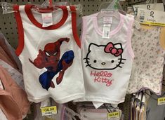 children's clothing for sale in a store with hello kitty and spiderman on them