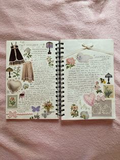 an open notebook with pictures and words on it sitting on a pink sheet covered bed