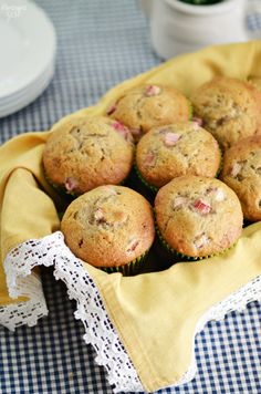 a basket filled with muffins sitting on top of a table