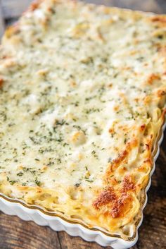 a cheesy casserole dish on a wooden table