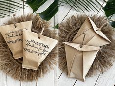 two origami pieces with writing on them are hanging from a wreath made out of fake fur