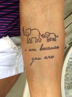 a person with a tattoo on their leg that says, i am because you are elephants