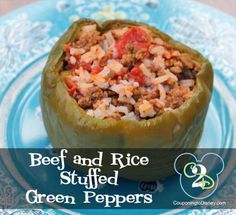 beef and rice stuffed green peppers on a blue plate with the words beef and rice stuffed green peppers