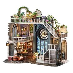 a doll house is shown with stairs, windows and plants on the top floor as well as a clock