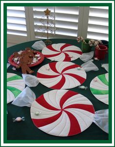 a table topped with candy canes and plates