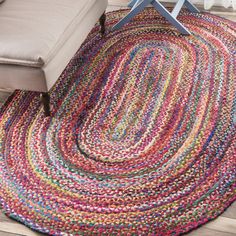 a multicolored area rug in a living room