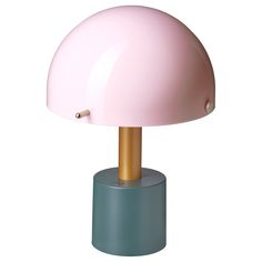 a pink and gold mushroom lamp on top of a blue base with a white background