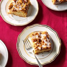 four plates with desserts on them and one has a fork in front of it