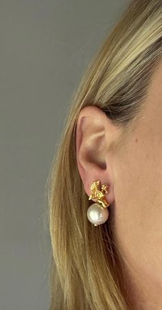 These earrings are from **Joan Rivers' 1980s collection featuring interchangeable beads, allowing for versatility and customization in your look. The set includes a selection of gold, silver, and pearl-like beads, which can be switched depending on the occasion or outfit.  The main element of these earrings is the intricate gold-plated cherub figure, adding a touch of whimsy and elegance to the design. Joan Rivers' jewelry line was known for high-quality craftsmanship and timeless, classic pieces with a playful edge. The interchangeable aspect makes these earrings not only stylish but practical, enabling the wearer to easily adapt them for both casual and formal settings. Joan Rivers Jewelry, Joan Rivers, Timeless Classic, Jewelry Earrings Studs, Etsy Earrings, Jewelry Earrings, Stud Earrings, High Quality, Gold