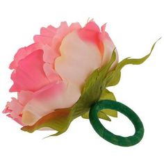 a pink and white flower with a green ring on it's end, in front of a white background