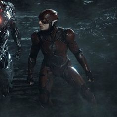 the flash and cy - man are walking in front of each other