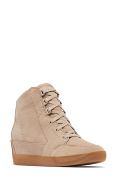 A sporty silhouette adds a casual-cool vibe to this bootie-style sneaker with a soft suede upper and hidden wedge heel. 2 1/2" heel; 1" platform (size 8.5) 5 1/4" shaft Removable insole Cushioned EVA footbed with arch support Leather upper/textile lining/rubber sole Imported Casual Leather Lace-up Wedge Boots, Casual Lace-up Leather Wedge Boots, Casual Wedge Boots With Rubber Sole, Casual Suede Wedge Sneakers With Platform, Trendy Leather Mid-top Wedge Sneakers, Casual High-top Wedge Boots With Rubber Sole, Casual Suede Ankle Boot Sneakers, Suede Wedge Sneakers With Platform And Round Toe, Sporty Leather Wedge Heel Sneakers