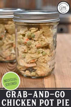 two mason jars filled with crab and go chicken pot pies on a wooden table