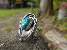 Size 2.75+ Sweet Small Vintage Sterling Turquoise and Raindrop Native American Leaf Feather Flower Pinky Ring  Hand Stamped, Handmade Morenci Turquoise Ring I wear pinky rings and it is important that they fit snuggly and are sturdy (I work in construction and all my rings need to be super sturdy, but my pinky rings need to be extra solid because they take a beating being out there on the end of things... :D ...OK, so this little sweet yet sturdy ring is a good example of what I look for in a ring in general and expressly for a pinky...AND it's beautiful Be sure of your finger size, you can do this by going to the craft store and fitting  your finger on a ring sizer...you don't need do buy it....remember that a ring sizer is round and this ring is flat at the top so there will be a TINY bi Pinky Rings, Morenci Turquoise, Iron Pyrite, Feather Flower, Navajo Jewelry, Ring Hand, Craft Store, Ring Sizer, Vintage Turquoise