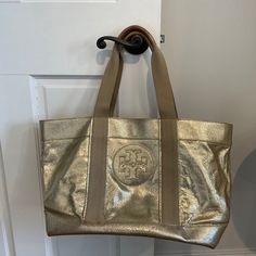 Reposhing This Item I Purchased From @Chrissylm12. Loved It, But Ready To Rotate For Something New. Questions? Leave A Comment Below! Gold Tote Bag, Tory Burch Bags, Tory Burch Bag, Metallic Gold, Womens Tote Bags, Something New, Tory Burch, Gold Metal, Tote Bags