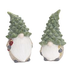 two ceramic christmas gnomes with trees on their heads