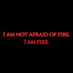 the words i am not afraid of fire on a black background with red text below