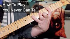 a person playing an electric guitar with the words how to play you never can tell