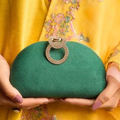 The Penguin (Green) clutch is a charming and distinctive accessory, designed in a modern D-shaped half-circle silhouette. This stylish clutch stands out with its unique single-piece motif, making it a delightful addition to any wardrobe. While visually striking, it is also thoughtfully crafted to be spacious and functional, ensuring it meets your practical needs without compromising on style. The clutch is designed in a sleek D-shape, mimicking a half-circle, which gives it a contemporary and ge Green Pouch Clutch For Wedding, Green Handheld Clutch For Wedding, Handheld Green Clutch For Wedding, Green Evening Pouch Clutch, Green Pouch Bags For Weddings, Green Pouch Bags For Wedding, Clutch With Detachable Handle For Gift, Handheld Clutch With Detachable Handle For Gifts, Handheld Clutch With Detachable Handle As Gift