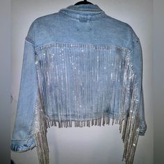 This Is An Oversized Cropped Denim Jacket With Rhinestone Fringe. Brand New With Tags. Never Worn. Women’s Size Medium. Fits Like A Women’s Size 10. See All Photos And Video. Long Sleeve Denim Jacket With Rhinestone Fringe, Casual Long Sleeve Denim Jacket With Rhinestone Fringe, Casual Denim Jacket With Rhinestone Fringe, Trendy Denim Jacket With Rhinestone Fringe For Fall, Trendy Spring Denim Jacket With Rhinestone Fringe, Party Denim Jacket Embellished, Spring Party Denim Jacket, Denim Outerwear With Rhinestone Fringe For Fall, Fall Denim Outerwear With Rhinestone Fringe