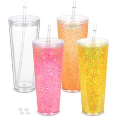 three different colored cups with straws in them and one is filled with confetti