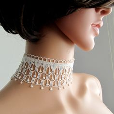 BUY 1 GET 1 FREE ! Gorgeous white lace choker. Made of french lace, high quality shiny rhinestones ( dmc ) interspersed on  choker  . Finished with gold coated chain and lobster claw. Great gift for your loved ones or pamper yourself . Dimensions; Total choker  lenght approx: 30.5  cm (  lace to lace )                          width  approx : 5 cm Thanks for checking out my site, and looking at my products. If you have any questions or would like to see more photos please don't hesitate to conta Corset Choker, Choker Patterns, Shower Light, White Lace Choker, Wedding Corset, Shoulder Necklace, Handmade Chokers, Tatting Jewelry, Bridal Choker