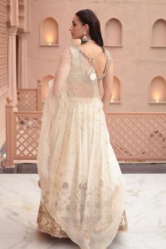 Off white lehenga featuring nakshi and sequins embroidery with an attached cancan. Paired with a padded blouse and a dupatta., Fit: Relaxed V Neck Blouse Lehenga, Off White Lehenga, Blouse Lehenga, White Lehenga, Padded Blouse, Sequins Embroidery, V Neck Blouse, Embroidered Blouse, Set For Women